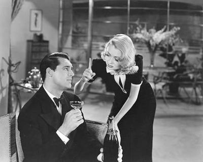 Cary Grant in film Topper holding champagne with Constance Bennett (1904 - 1965) Photo by Silver ScreenCollection, 1937