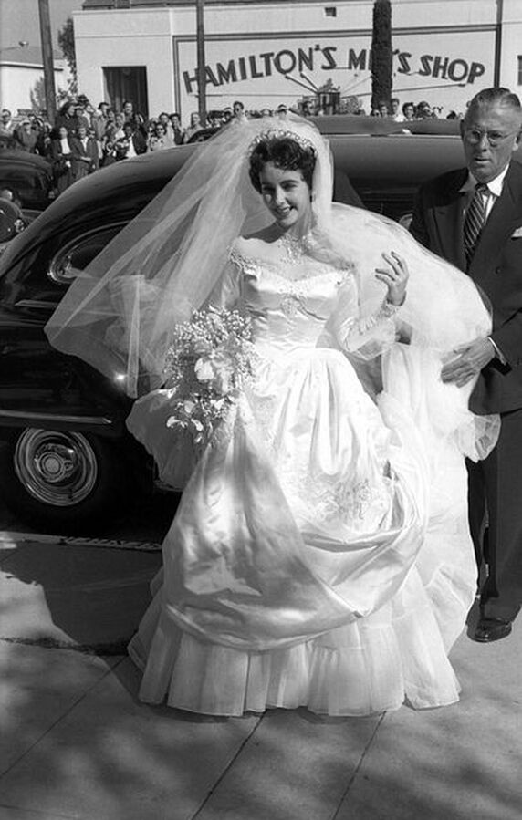 Elizabeth Taylor on her wedding day, wearing wedding gown designed by Helen Rose, May 6, 1950