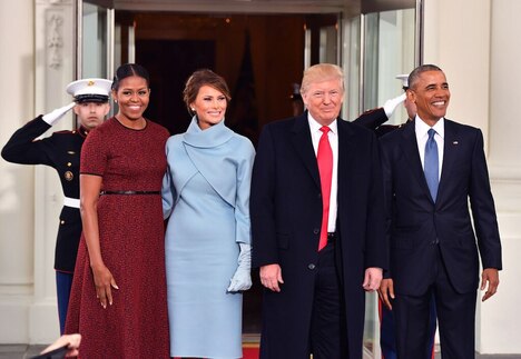 Donald Trump, and Melania Trump, are greeted by President Barack Obama and his wife first lady Michelle Obama on 20 January 2017 before the inauguration