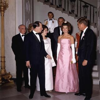 Jackie Kennedy (in Guy Dovier designed pink silk Shantung strapless gown) with John. F. Kennedy at White House, Washington, receiving Andre Malraux, The French Minister of Culture, 11 May 1962