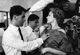 Karl Lagerfeld fitting with model when he worked for Jean Patou, on 21 July 1958
