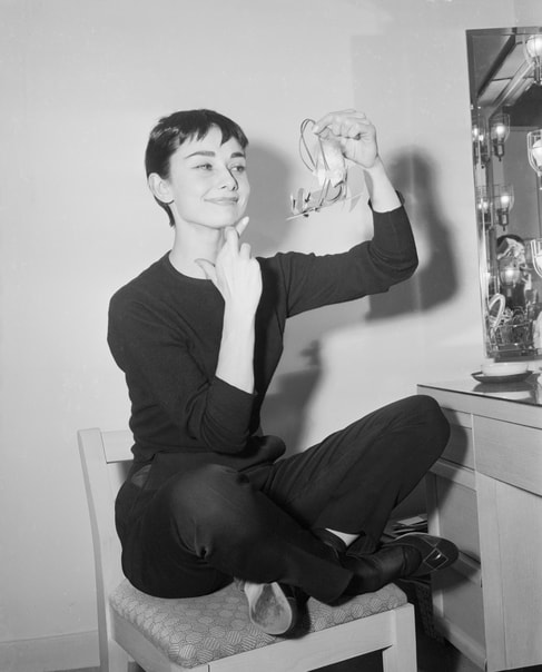 Audrey Hpeburn in black trousers and black jersey