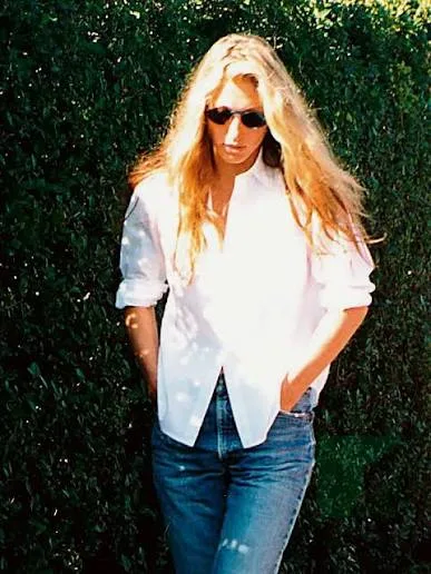Carolyn Bessette-Kennedy in her signature white shirt in New York in the late 1990s