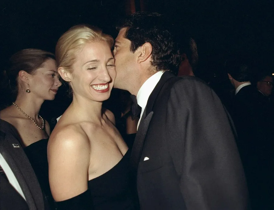 Carolyn Bessette-Kennedy in a black evening dress with and John F. Kennedy Jr. at a New York benefit, late 1990s