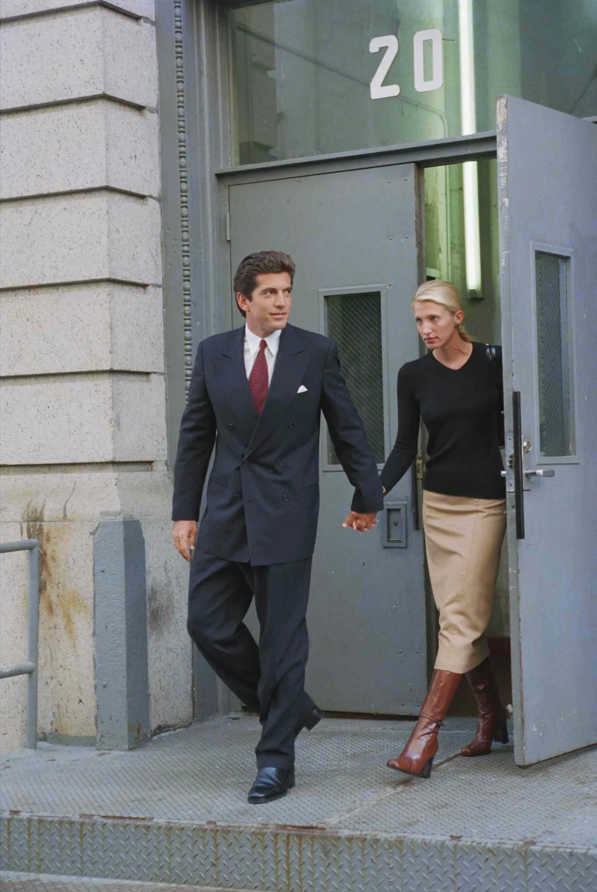 Carolyn Bessette-Kennedy and John F. Kennedy Jr. facing reporters outside their Tribeca home after their honeymoon, October 1996
