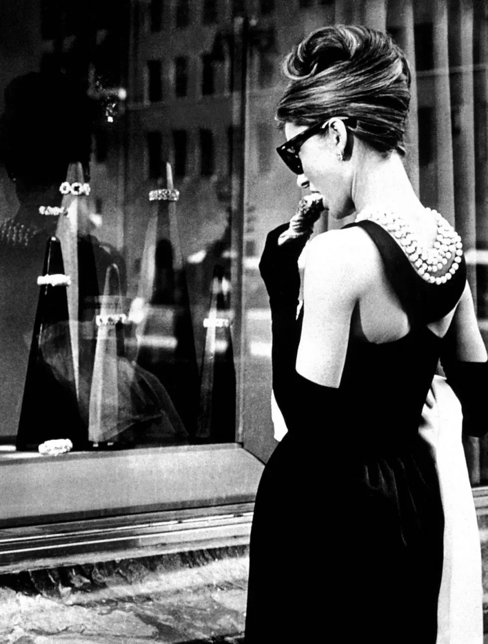 Audrey Hepburn's in film Breakfast at Tiffany's, her dress is designed by Hubert de Givenchy