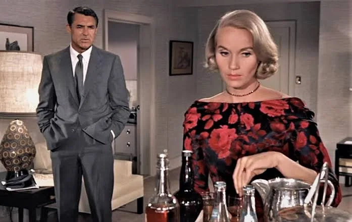 Eva Marie Saint in a black rose dress with Cary Grant in a hotel room in North by Northwest (film, 1959)