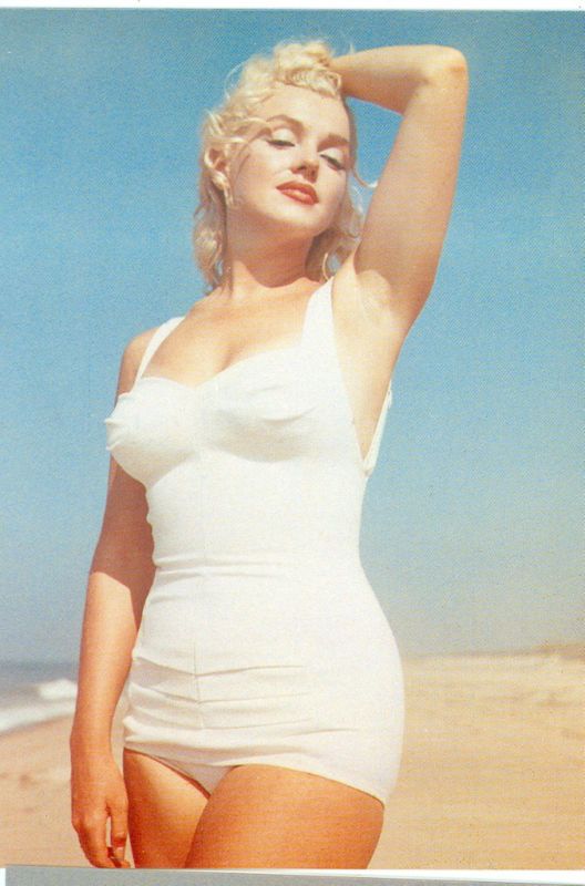 Elegant style icon wardrobe essentials: Marilyn Monroe in swimwear, a one piece white bathing swimming suit