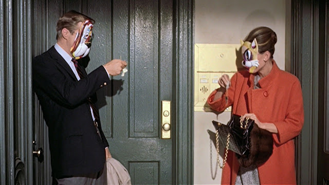 Audrey Hepburn movie costume in film Breakfast at Tiffany's(1961), the complete wardrobe of Holly Golightly:Orange double breast wool coat with standup collar and 3 quarter sleeves