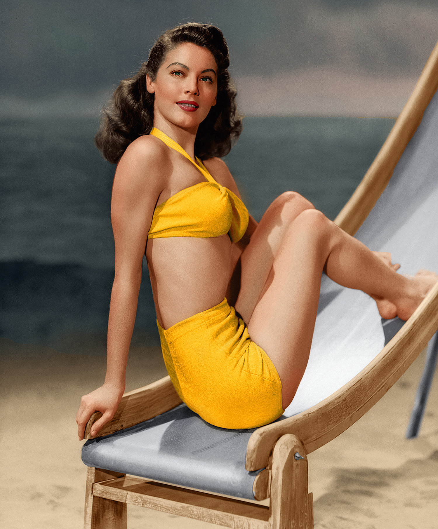 Elegant style icon wardrobe essentials: Ava Gardner in swimwear, a two piece bikini in solid color