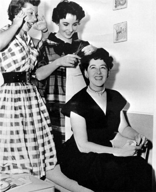 Helen Rose(sitting) with Elizabeth Taylor and Annabella Levy on the set of Rhapsody (1954)