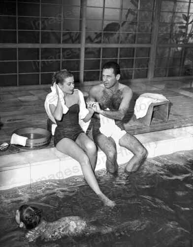 Elegant style icon wardrobe essentials: Grace Kelly in swimwear, a strapless one piece swimming suit, in film The Bridges at Toko-Ri(1954)