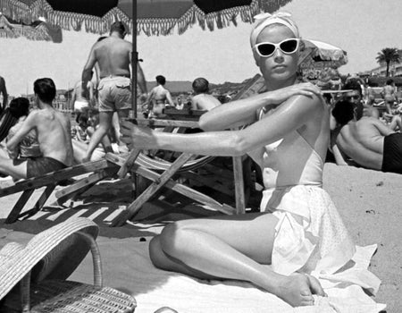 Elegant style icon wardrobe essentials: Grace Kelly in swimwear, a halter neck one piece swimming suit, in film To Catch a Thief(1956)