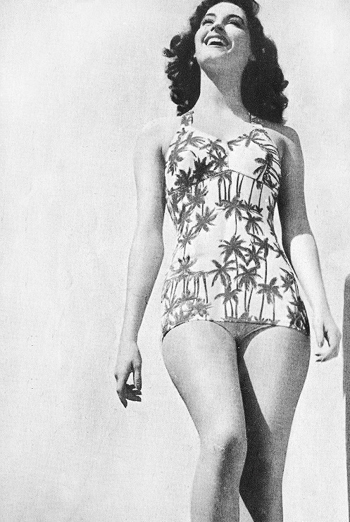 Elegant style icon wardrobe essentials: Ava Gardner in swimwear, a one piece swimsuit in print