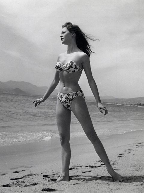 Elegant style icon wardrobe essentials: Brigitte Bardot in swimwear, a two piece bikini in floral print