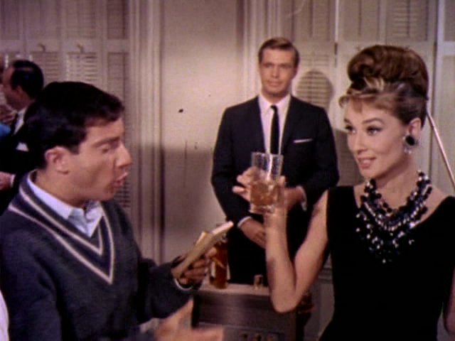Audrey Hepburn movie costume in film Breakfast at Tiffany's(1961), the complete wardrobe of Holly Golightly:Black sleeveless knee length dress with tie belt and hem fringes
