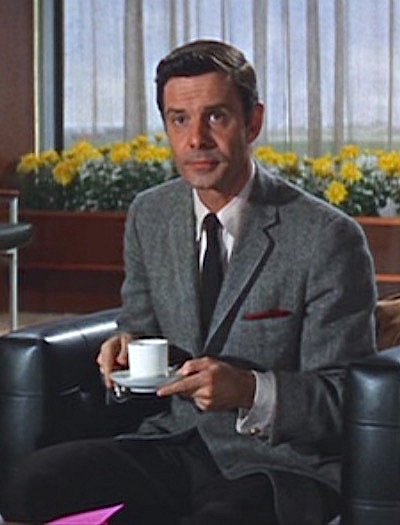 Louis Jourdan as Marc Champselle in film ​The V.I.P.s