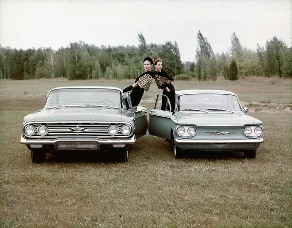Two models Leaning Out Of Cars, photo by John Rawlings(1912-1979)