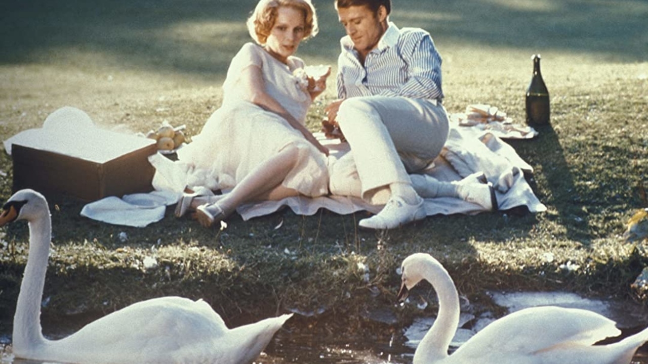 Mia Farrow and Robert Redford in film The Great Gatsby(1974), whose costume was designed by Theoni V. Aldredge