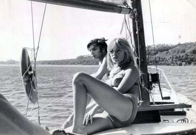 Elegant style icon wardrobe essentials: Brigitte Bardot in swimwear, a one piece strapless swimsuit