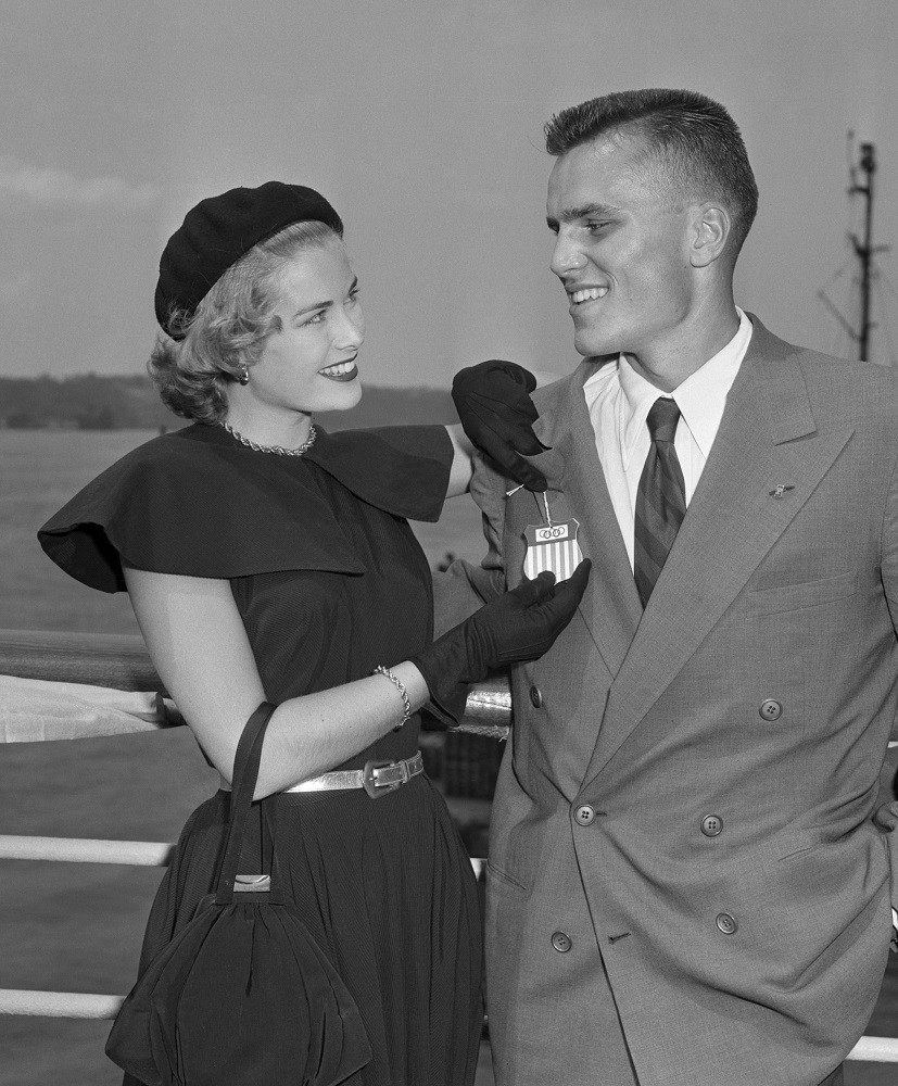 Elegant style icon wardrobe essentials: Grace Kelly in black dress, with her brother Jack Kelly, 1948