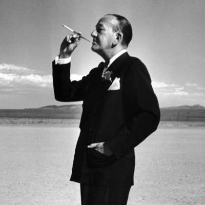 Noel Coward with cigarette holder