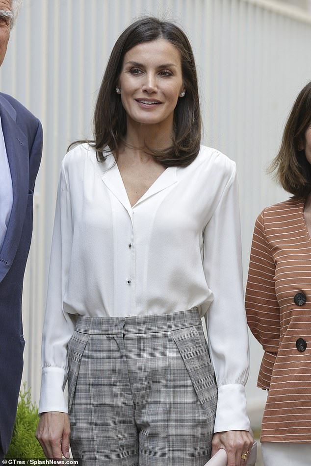 Elegant style icon wardrobe essentials: Queen Letizia of Spain in white shirt