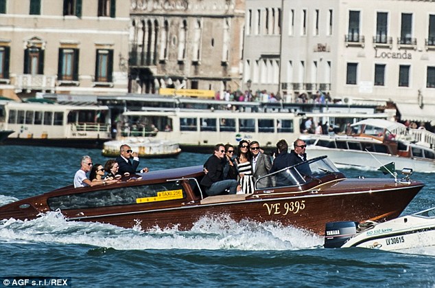 Amal Clooney black and white stripe dress by Dolce&Gabbana, Venice Italy, September 2014