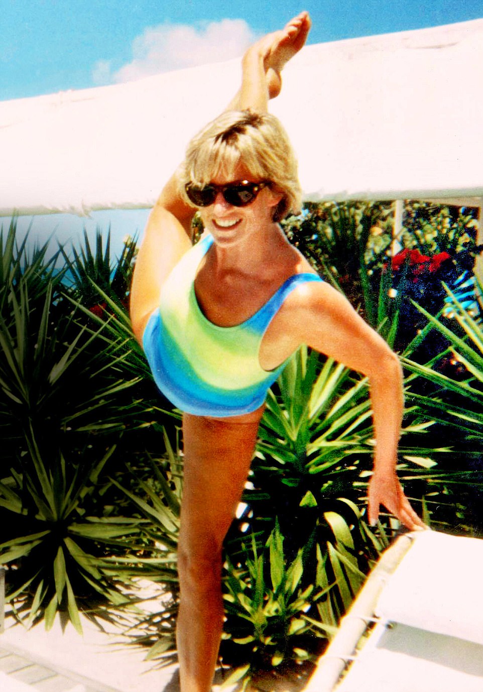 Elegant style icon wardrobe essentials: Princess Diana in swimwear, a one piece swimsuit with neon green and blue print