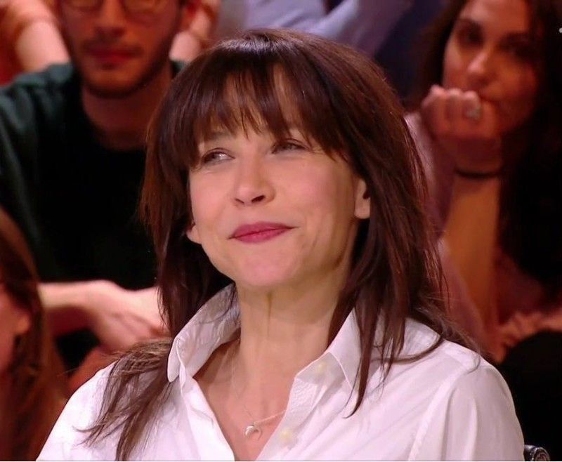 Elegant style icon wardrobe essentials: Sophie Marceau in white shirt