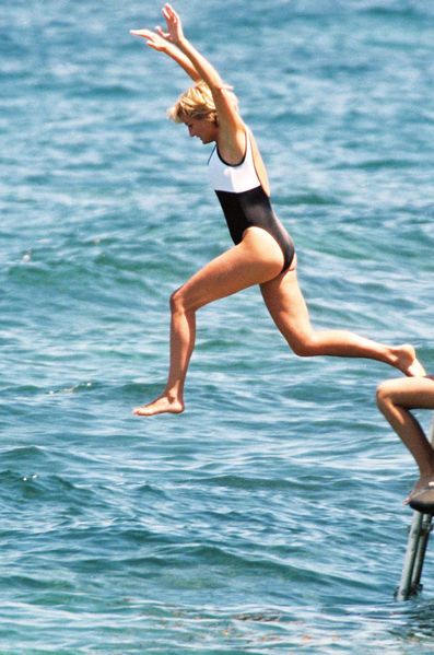 Elegant style icon wardrobe essentials: Princess Diana in swimwear, a one piece black white swimsuit