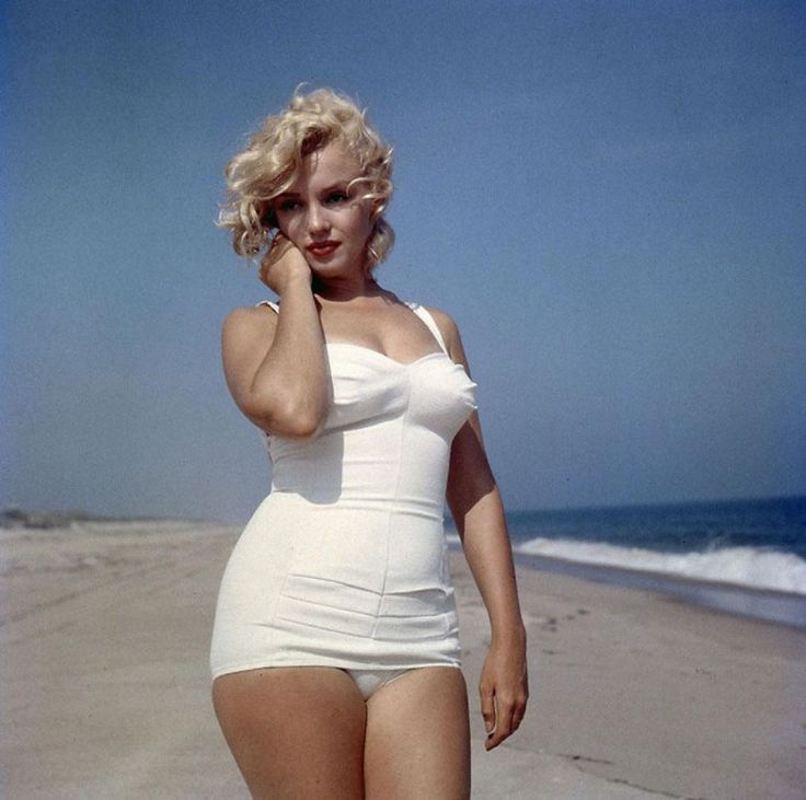 Elegant style icon wardrobe essentials: Marilyn Monroe in swimwear, a one piece white bathing swimming suit