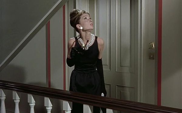 Audrey Hepburn movie costume in film Breakfast at Tiffany's(1961), the complete wardrobe of Holly Golightly:Black floor length sleeveless dress with moonlike back cut-out