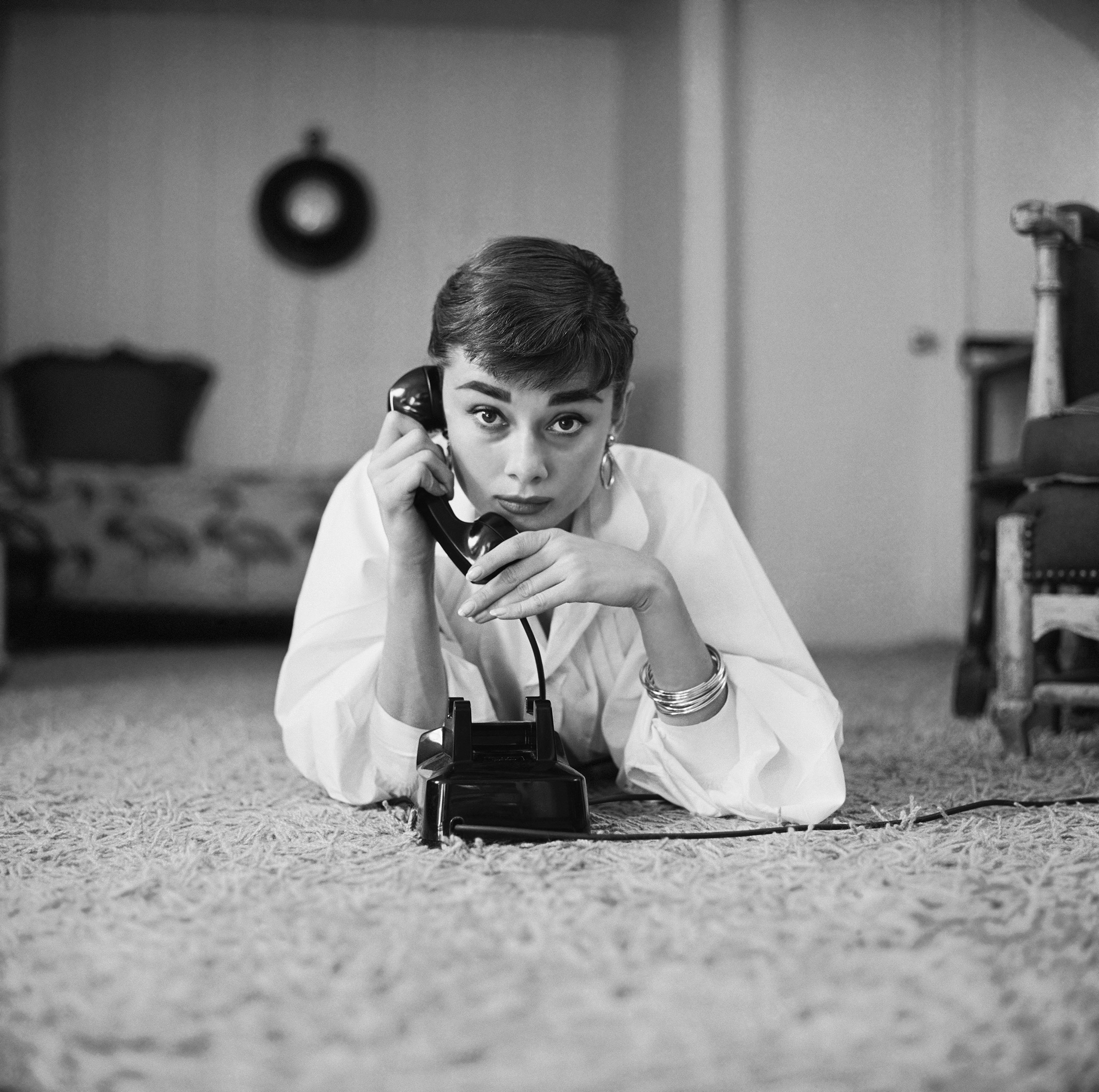 Audrey Hepburn in white shirt at home, photo by Mark Shaw