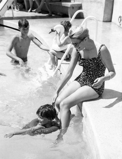 Elegant style icon wardrobe essentials: Grace Kelly in swimwear, a one piece printed swimming suit