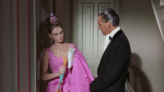 Audrey Hepburn movie costume in film Breakfast at Tiffany's(1961), the complete wardrobe of Holly Golightly:Fuchsia pink sleeveless knee length dress with scoop neck and bow waist, with matching coat of three-quarter sleeves