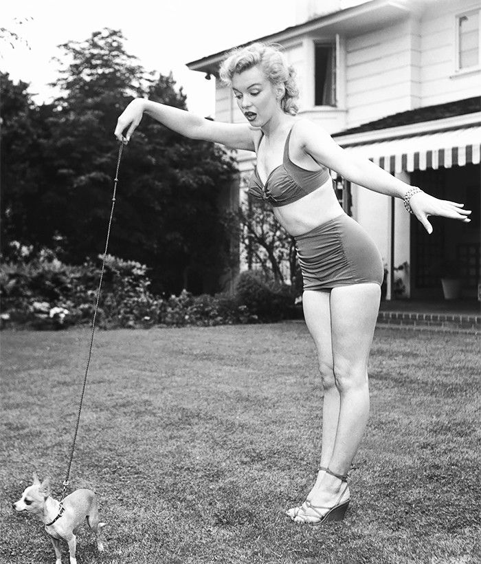 Elegant style icon wardrobe essentials: Marilyn Monroe in swimwear, a two piece bikini