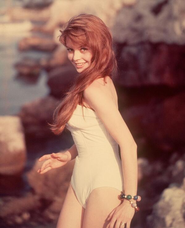 Elegant style icon wardrobe essentials: Brigitte Bardot in swimwear, a one piece strapless swimsuit