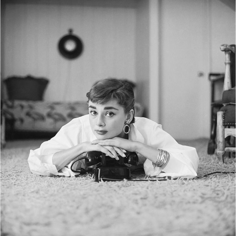 Audrey Hepburn in white shirt at home, photo by Mark Shaw