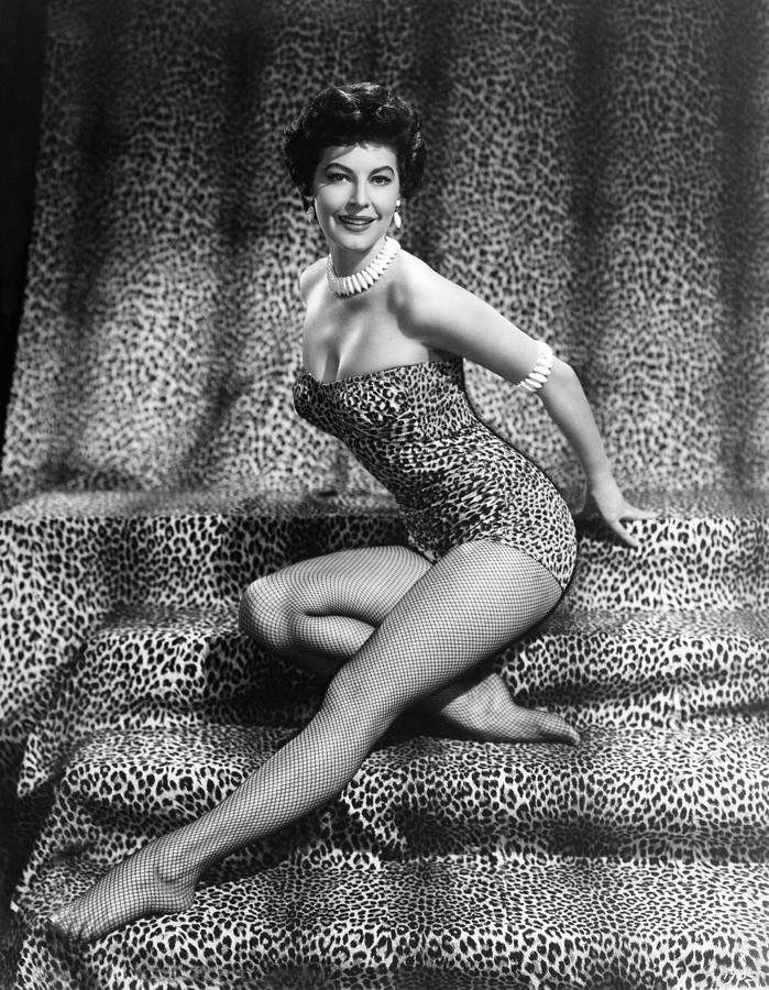 Elegant style icon wardrobe essentials: Ava Gardner in swimwear, a one piece swimsuit in leopard print