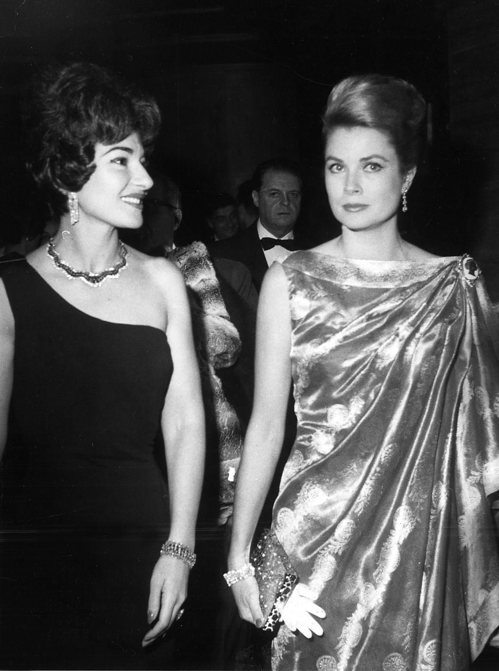Elegant style icon wardrobe essentials: Maria Callas in black dress, with Grace Kelly, Princess of Monaco, 1962