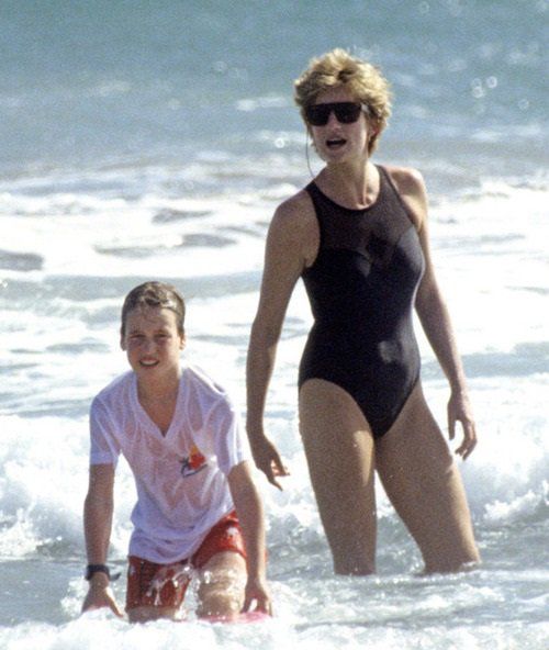 Elegant style icon wardrobe essentials: Princess Diana in swimwear, a one piece black swimsuit