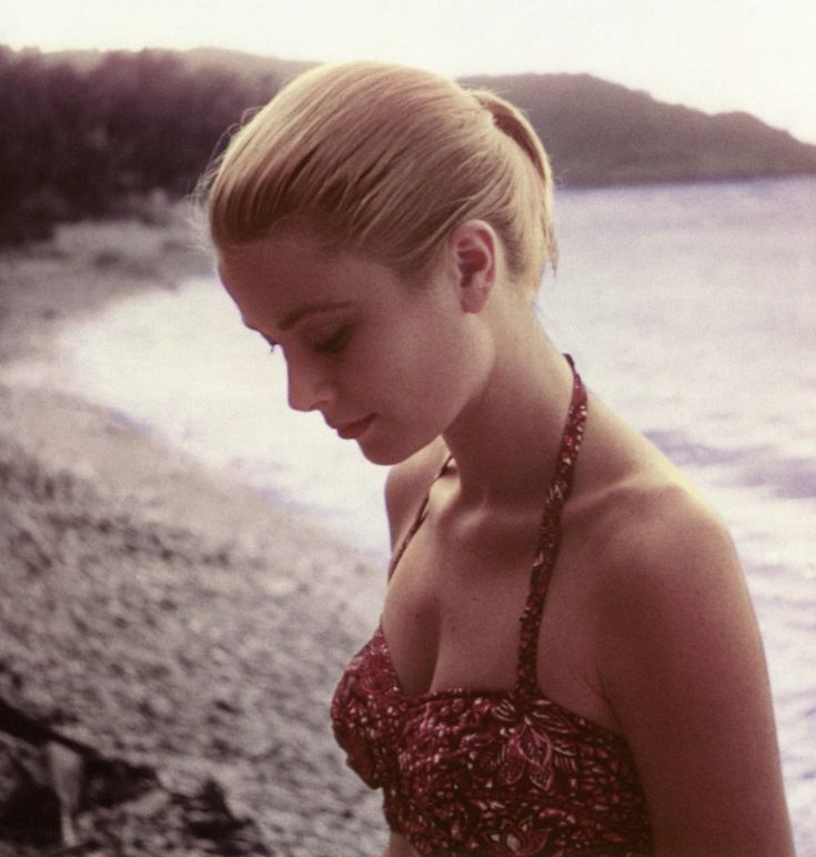 Elegant style icon wardrobe essentials: Grace Kelly in swimwear, a halter neck printed one piece swimming suit