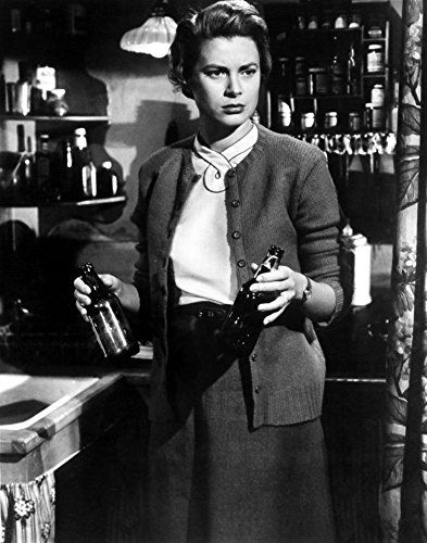 Elegant style icon wardrobe essentials: Grace Kelly in cardigan sweater: Grace Kelly wearing cardigan sweater in film The Country Girl(1954)