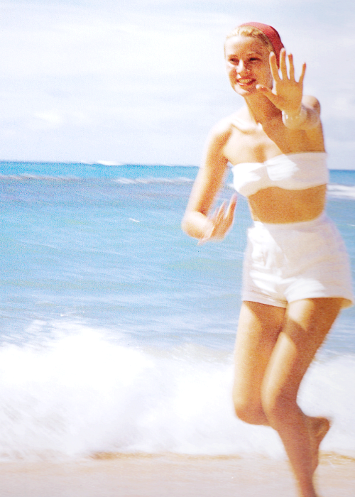 Elegant style icon wardrobe essentials: Grace Kelly in swimwear, a white strapless bikini