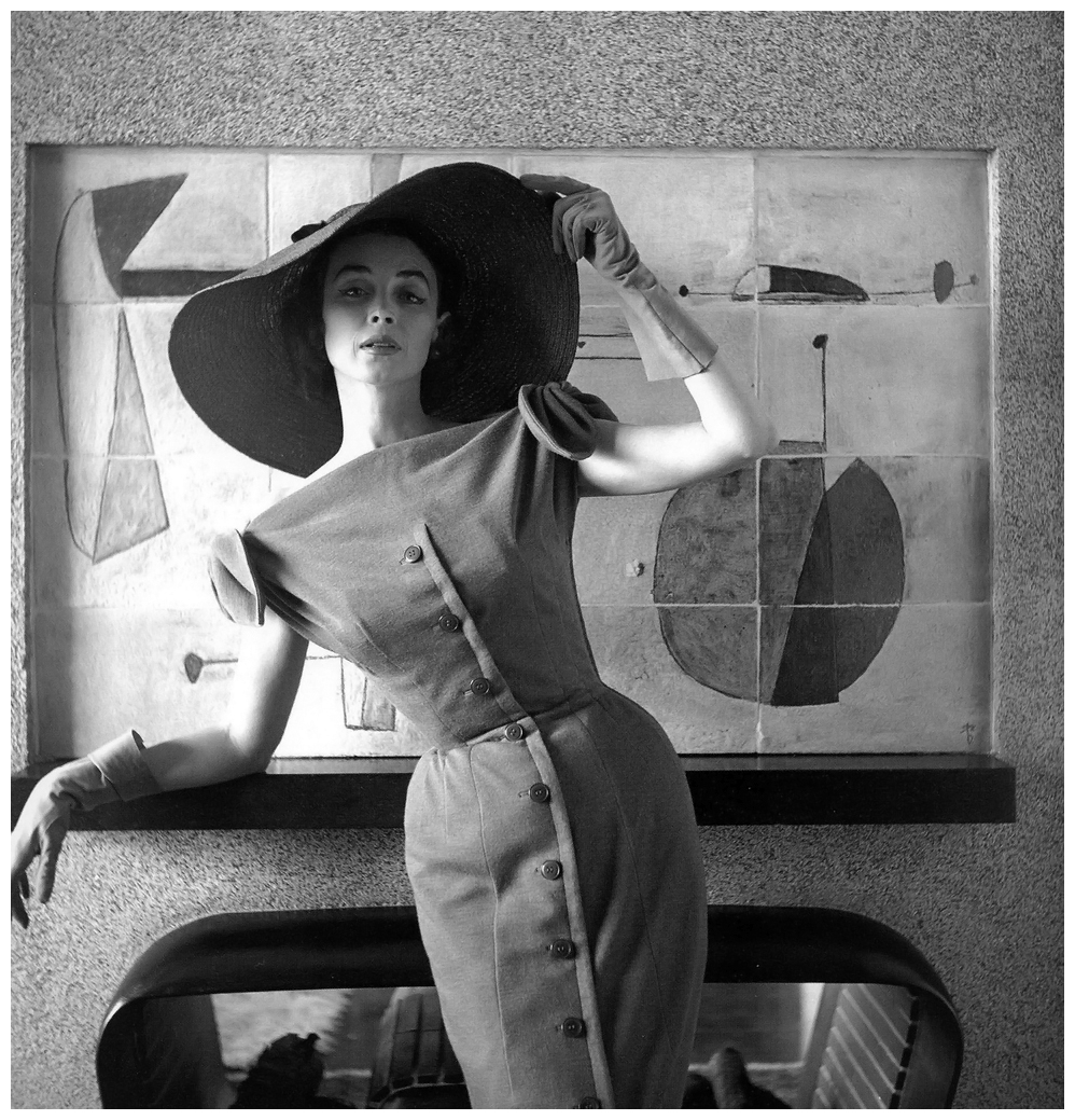 Dorian Leigh (April 23, 1917 – July 7, 2008), the first American supermodel, in black dress with cap sleeves, 1954