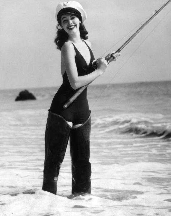 Elegant style icon wardrobe essentials: Ava Gardner in swimwear, a one piece swimsuit in solid color