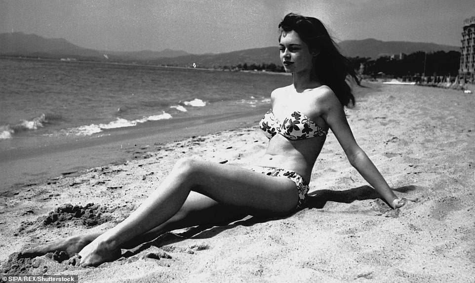Elegant style icon wardrobe essentials: Brigitte Bardot in swimwear, a two piece bikini in floral print