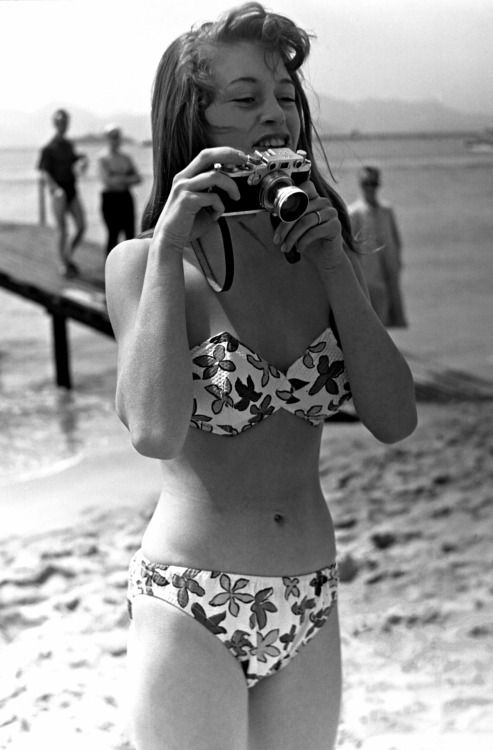 Elegant style icon wardrobe essentials: Brigitte Bardot in swimwear, a two piece bikini in floral print