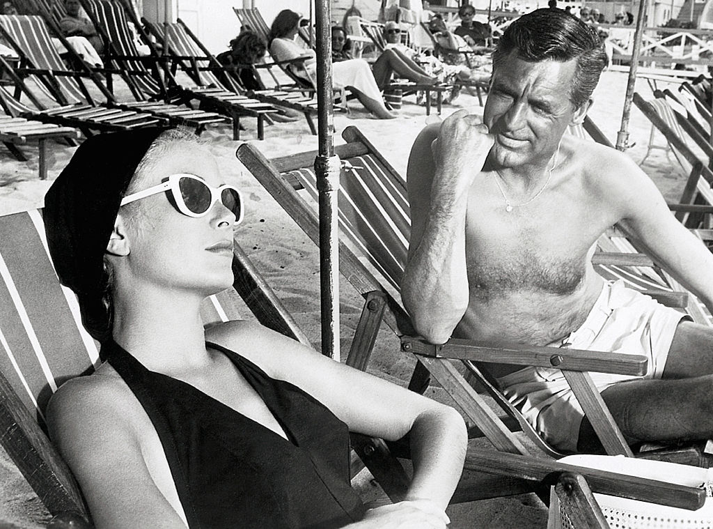 Elegant style icon wardrobe essentials: Grace Kelly in swimwear, a halter neck one piece swimming suit, in film To Catch a Thief(1956)